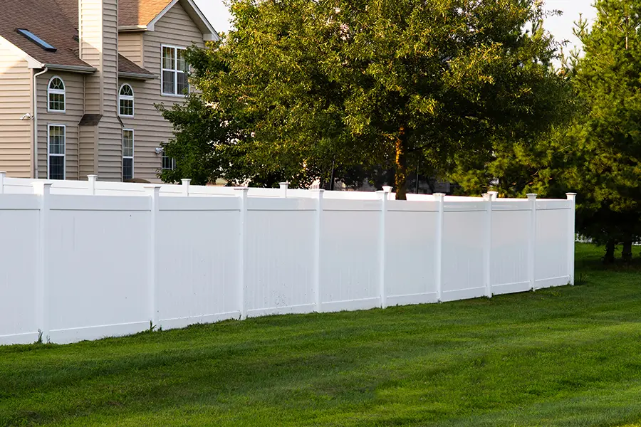 Residential Vinyl Fence behind a new house
